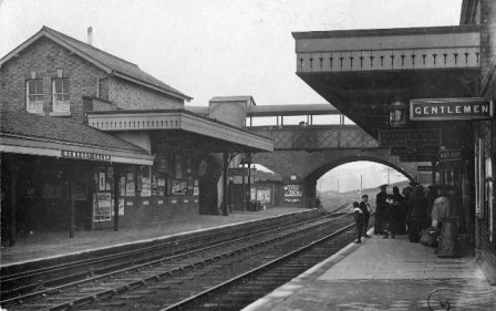 Newport railway station staff with people on platform.