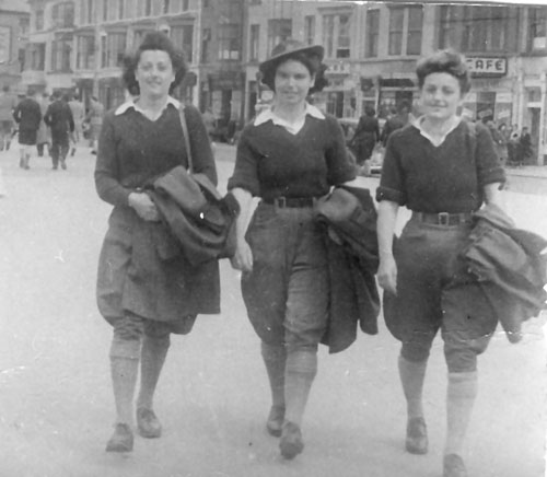 Three land army girls on a day trip to Rhyl.